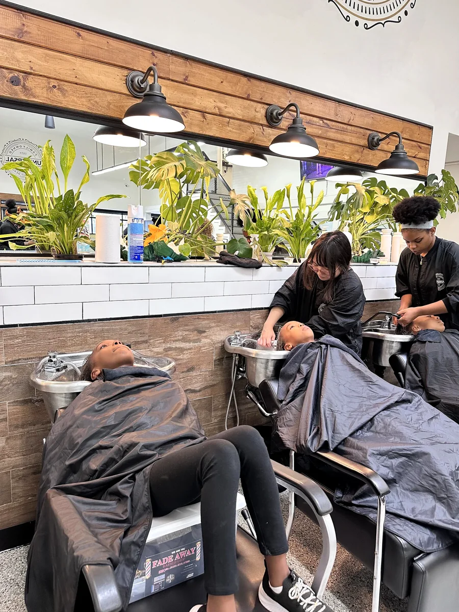Crowned & Ready 2026: A participant receiving a hair-washing service