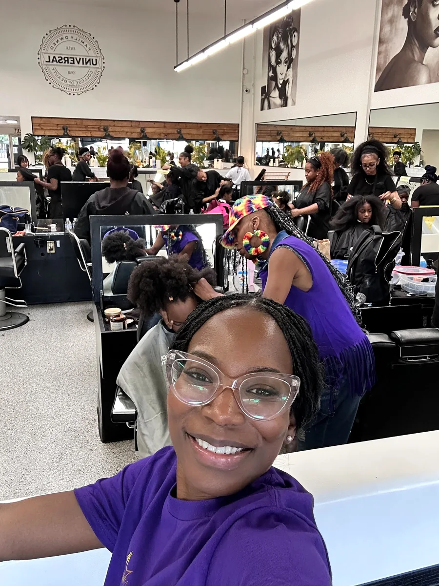 Crowned & Ready 2026: An event participant in purple with the active salon behind her