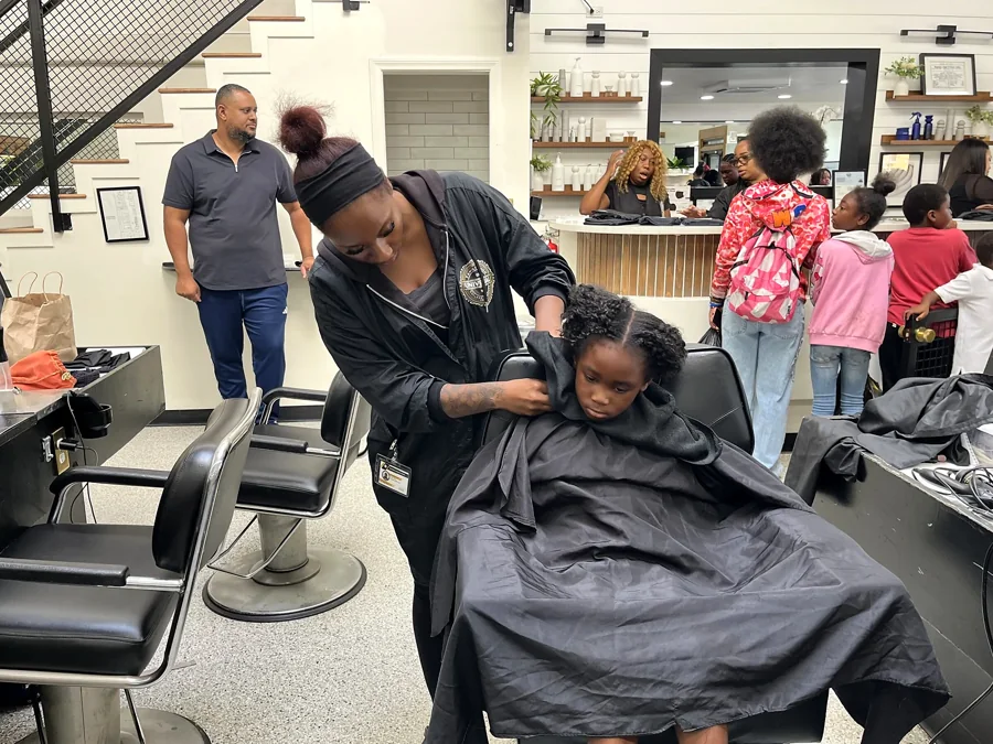 Crowned & Ready 2026: A stylist providing haircare to a child seated in a salon chair