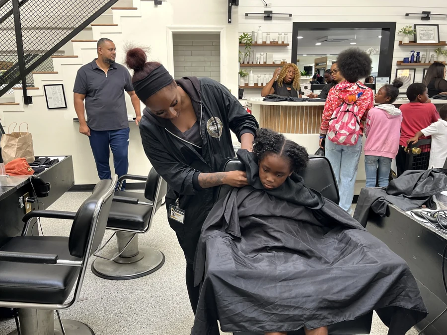 Crowned & Ready 2026: A stylist providing haircare to a child seated in a salon chair